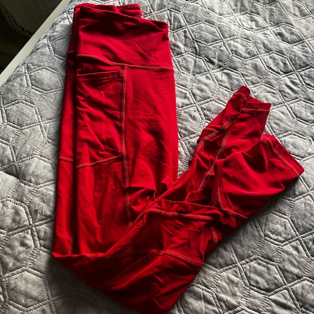 Pink, Red leggings with mesh criss cross at bottom, Size S